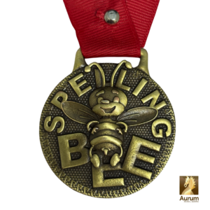 Medalla Spelling Bee en oro antiguo de 5 cm de diámetro